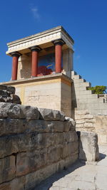 Low angle view of historical building against blue sky