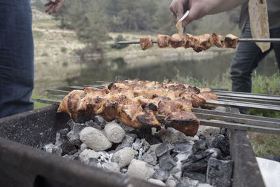 Man preparing food on barbecue grill