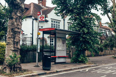 View of bus stop on street against building