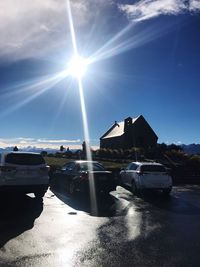 Cars on road against sky