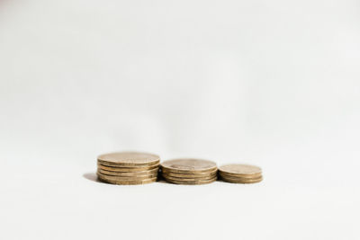 Close-up of stack of objects against white background