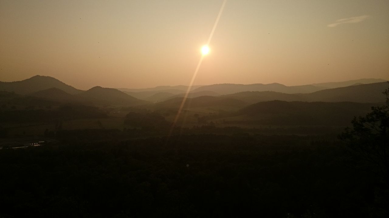 mountain, mountain range, tranquil scene, scenics, tranquility, sun, beauty in nature, sunset, silhouette, landscape, nature, idyllic, clear sky, sky, lens flare, non-urban scene, sunlight, copy space, dark, remote