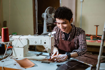 Side view of man working at home