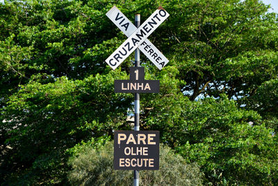 Information sign against trees