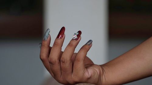 Close-up of woman hand showing nail art