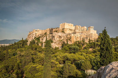 Low angle view of acropolis of athens against sky