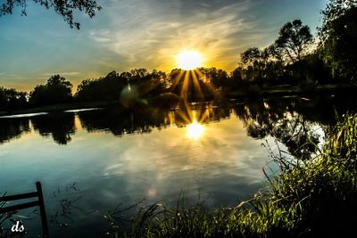 Scenic view of lake at sunset