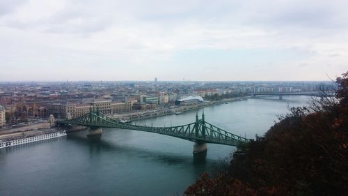 View of bridge over river in city