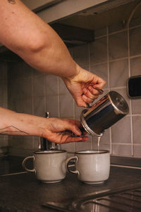 Midsection of man preparing food