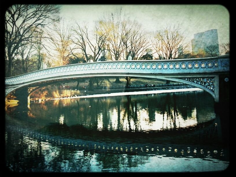 transfer print, water, tree, architecture, built structure, reflection, auto post production filter, bare tree, bridge - man made structure, connection, river, arch bridge, waterfront, sky, bridge, arch, lake, canal, building exterior, no people