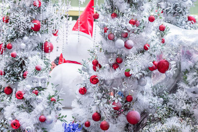 Close-up of christmas decorations on snow