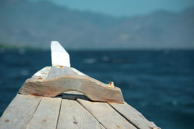 Close-up of wood over sea