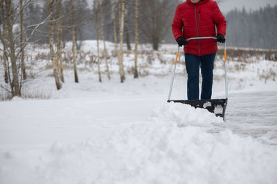 Man skiing on snow covered field