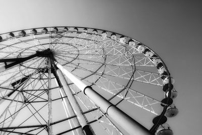 Low angle view of ferris wheel against sky