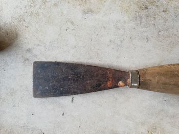 High angle view of rusty sign on metal