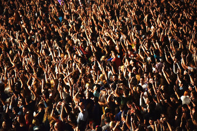 Full frame shot of crowd cheering at popular music concert