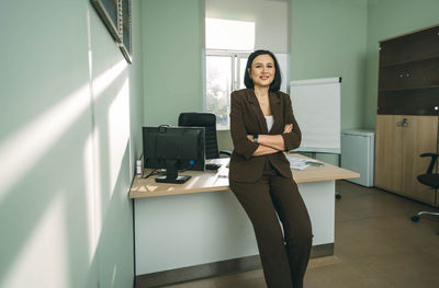 Happy businesswoman in office. stylish beautiful manager smiling, working on financial projects