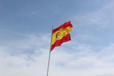 Low angle view of flag against sky