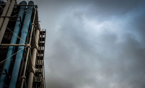 Low angle view of ferris wheel against sky