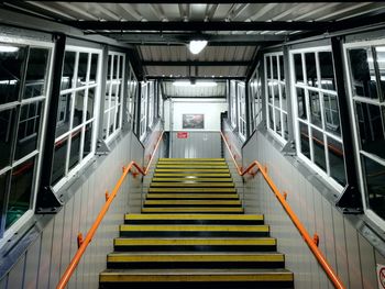 Staircase in illuminated underground walkway