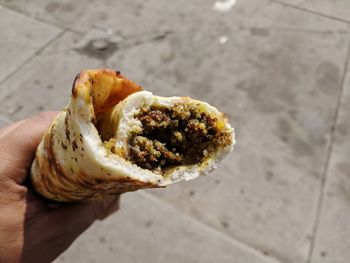 Close-up of hand holding bread