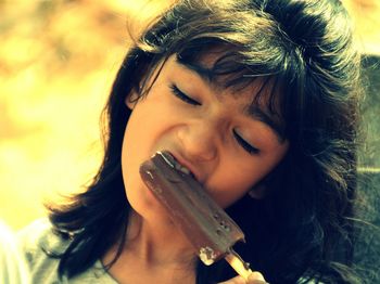 Close-up of girl eating ice cream