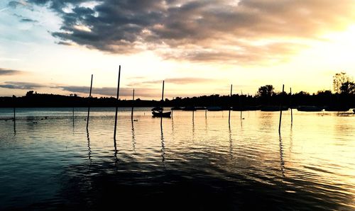 Scenic view of lake against sky during sunset