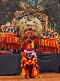 Full length of man wearing traditional clothing standing outdoors