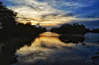 Scenic view of lake against sky during sunset