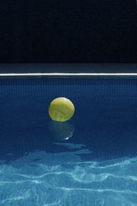 High angle view of beach ball floating on swimming pool