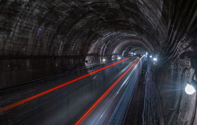 Light trails in tunnel at night
