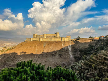 Scenic view of castle and landscape against sky