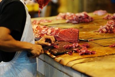 Midsection of man preparing food