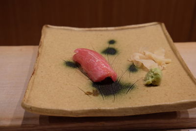 Close-up of sushi served on table