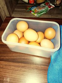 High angle view of eggs in container on table