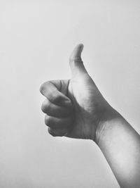 Close-up of human hand against white background