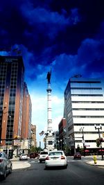 Low angle view of buildings against cloudy sky