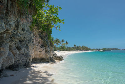 Scenic view of sea against clear blue sky