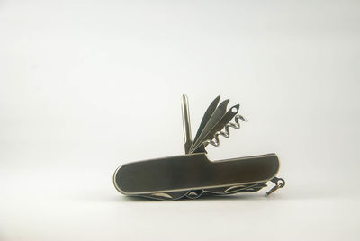 Close up of guitar against white background