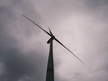 Low angle view of windmill against sky