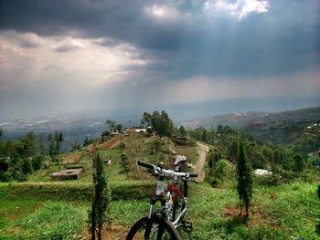 Scenic view of landscape against cloudy sky