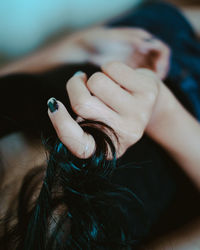 Close-up of woman holding hands