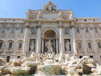 Statue of historic building against sky