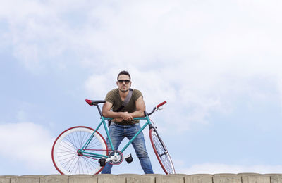 Portrait of young man riding bicycle