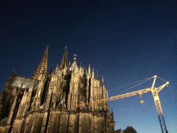 Low angle view of built structure against blue sky