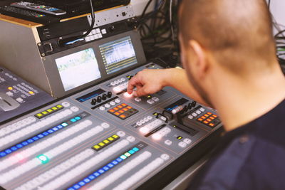 Close-up of man using sound mixer 