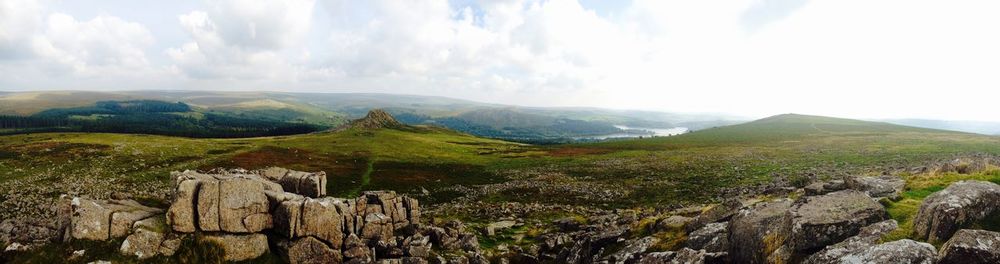 Panoramic view of green landscape against sky