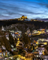 Aerial view of illuminated buildings in city