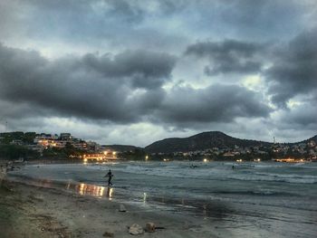 Scenic view of sea against cloudy sky