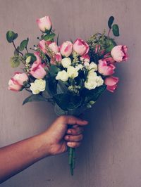 Close-up of hand holding bouquet